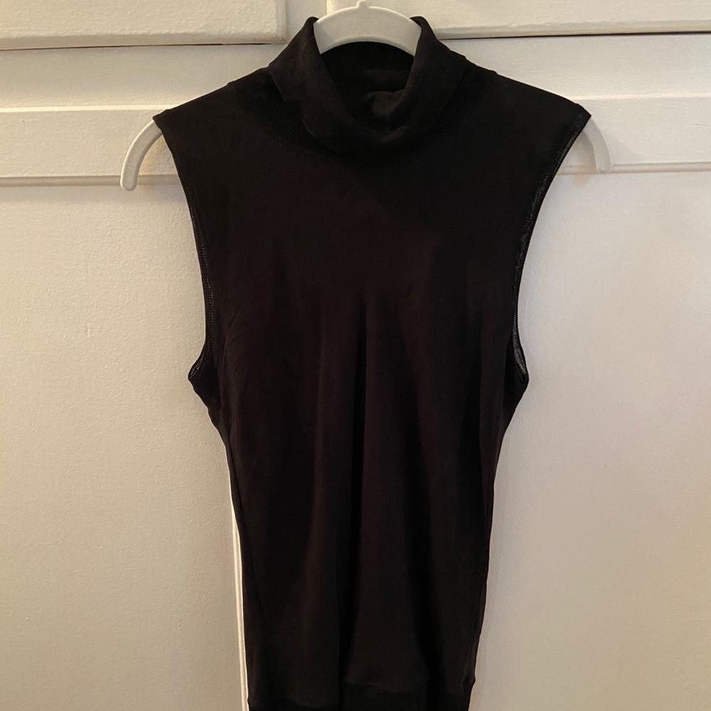 Sleeveless black turtleneck